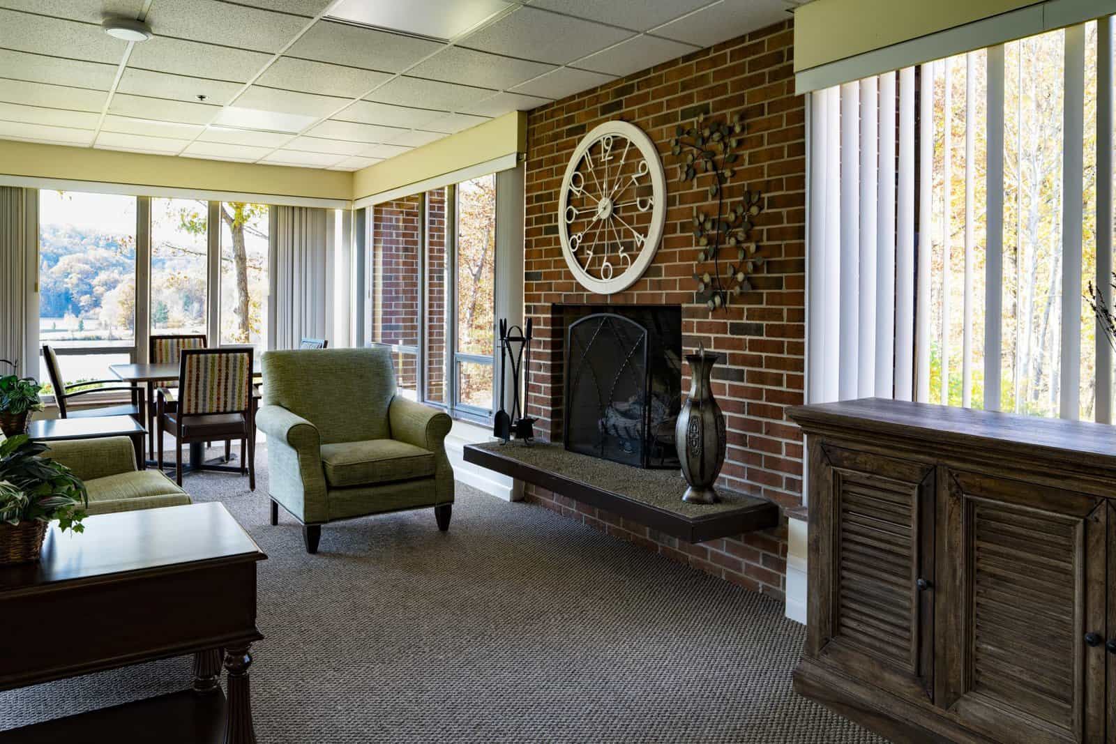 Sunroom with fireplace at GlenWood Park Princeton